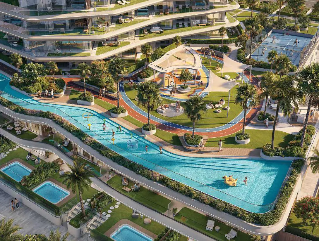 Beach style lagoon swimming pool and landscaped sun deck area surrounding Bab Al Qasr Residence 51 Al Raha Beach.