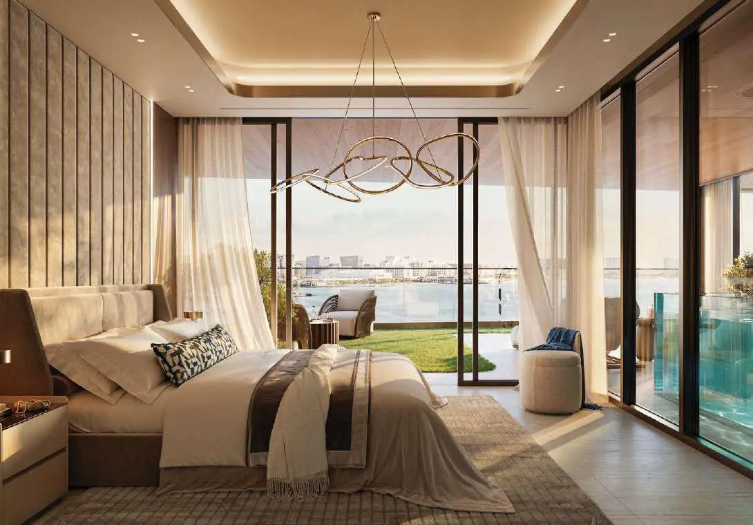 Dramatic double height ceiling living room featuring floor to ceiling glass walls at Bab Al Qasr Residence 51 Abu Dhabi.