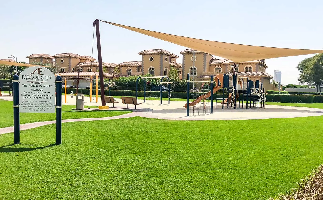 Architectural exterior of Al Ghadeer community buildings in Abu Dhabi, UAE with modern design elements..jpg