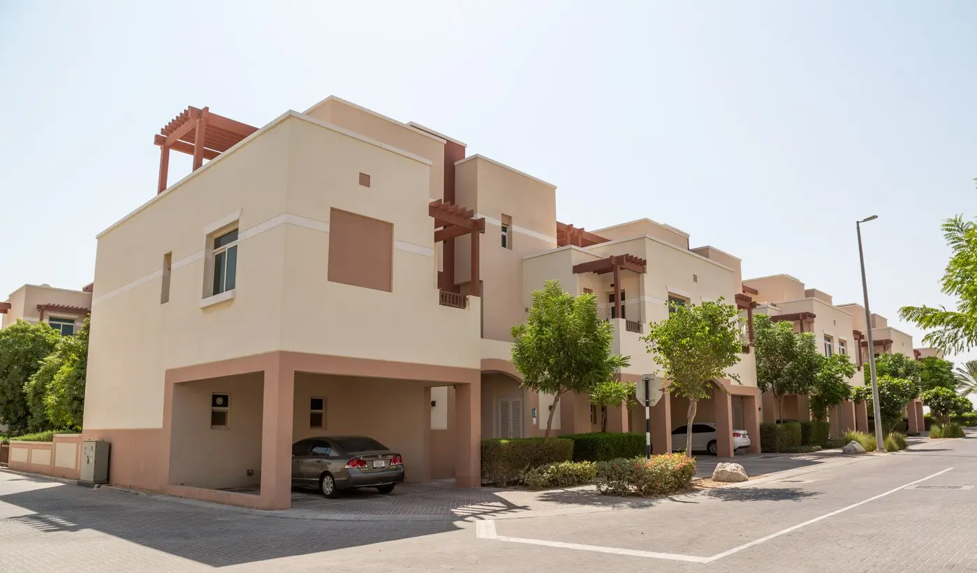Villas with private gardens and landscaped surroundings in Al Ghadeer residential community, Abu Dhabi, UAE.jpg