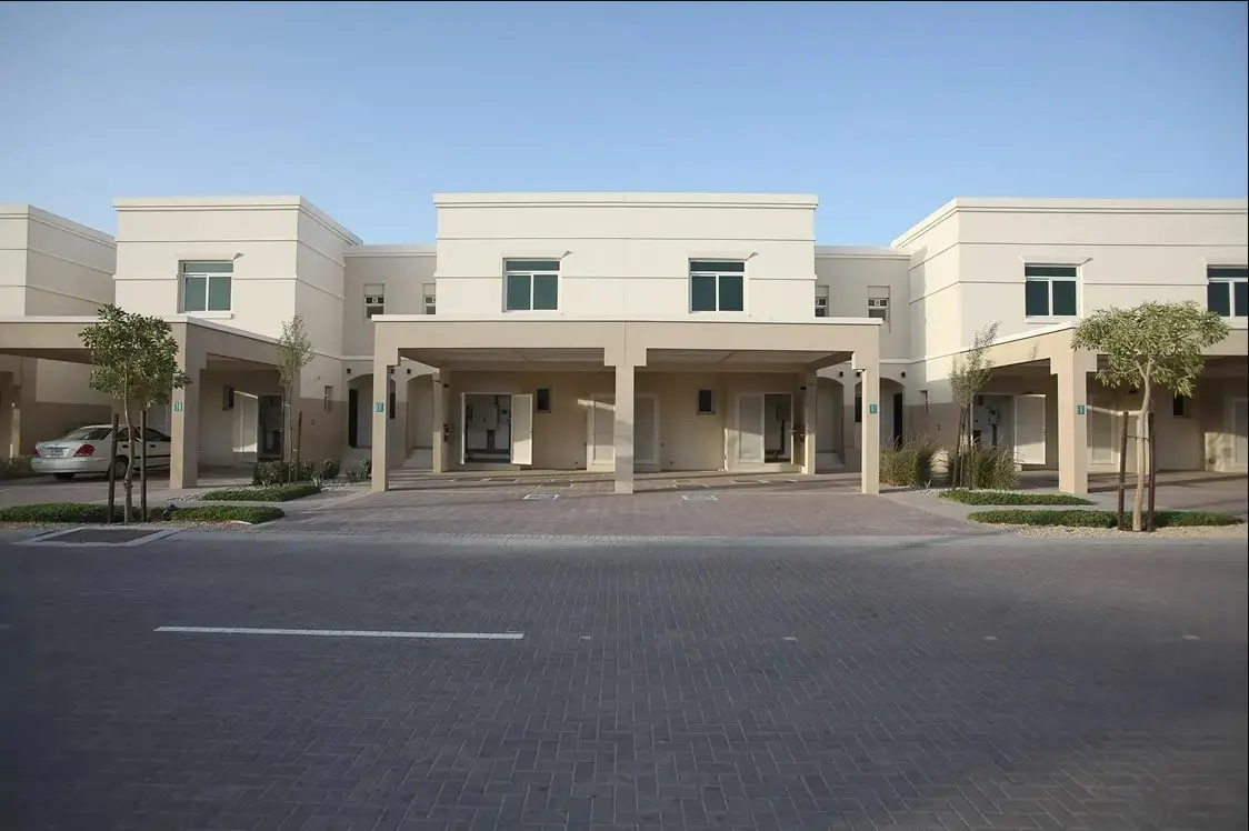 Aerial view of Al Ghadeer in Abu Dhabi, UAE showcasing landscaped green spaces and modern residential clusters.jpg
