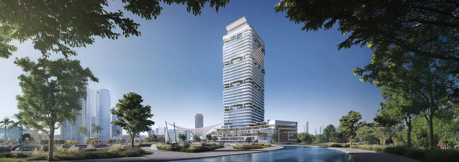Radiant Elite Tower exterior façade showcasing the iconic curved architecture with panoramic sea and canal views.