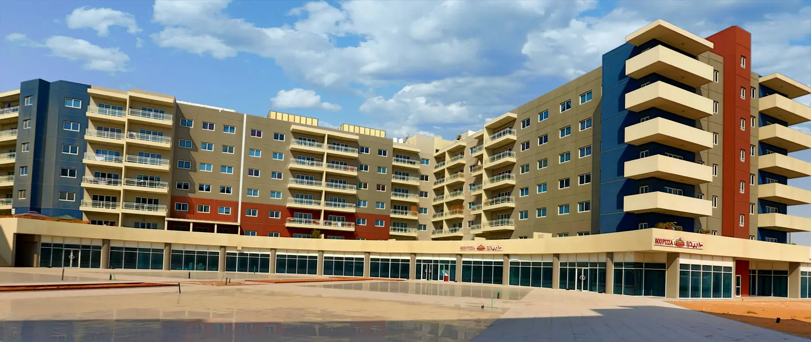 Contemporary exterior architecture of Al Reef Downtown in Al Reef Abu Dhabi showcasing premium apartment buildings and urban living spaces