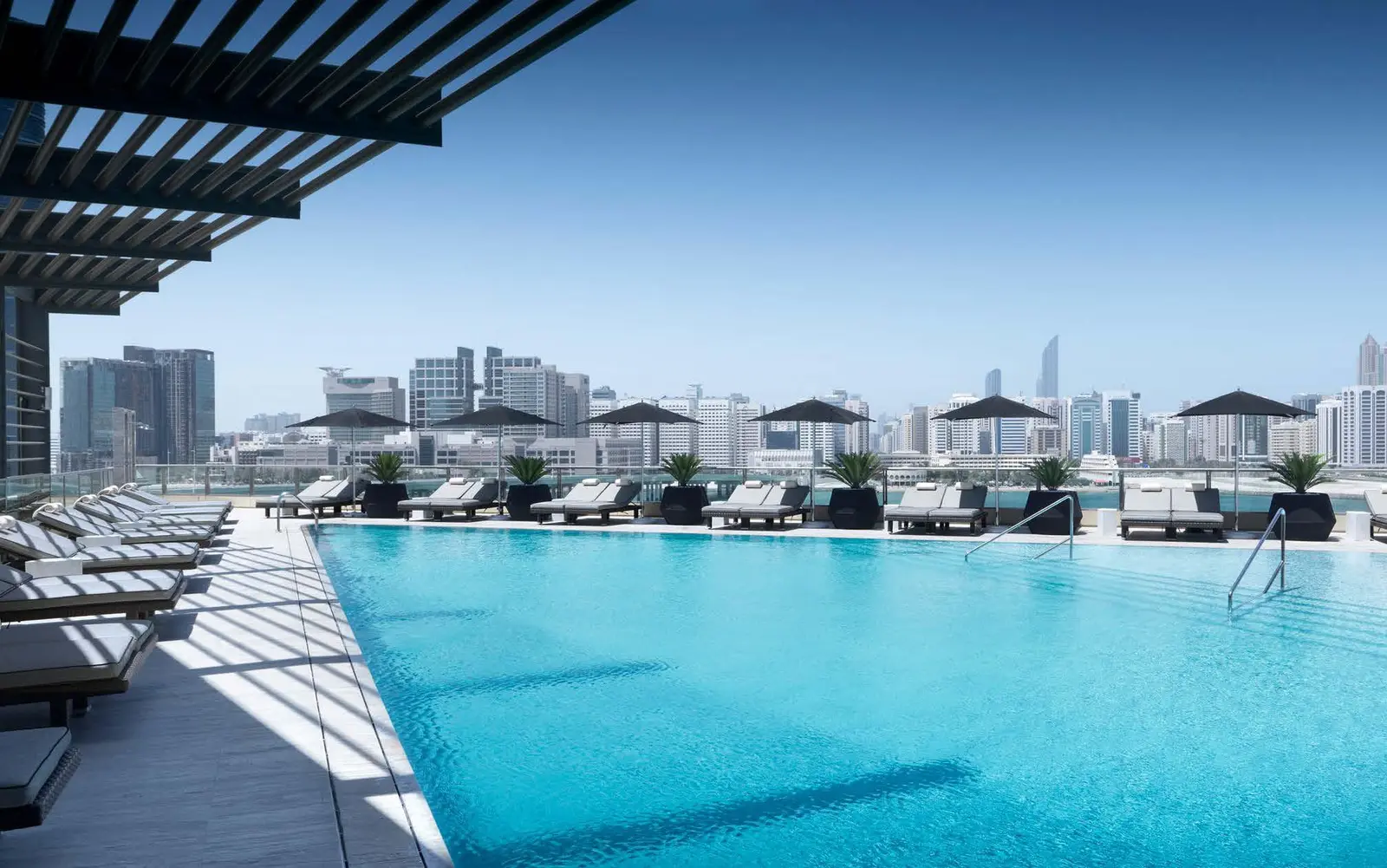 Al Maryah Island luxury residential towers against blue sky with waterfront setting