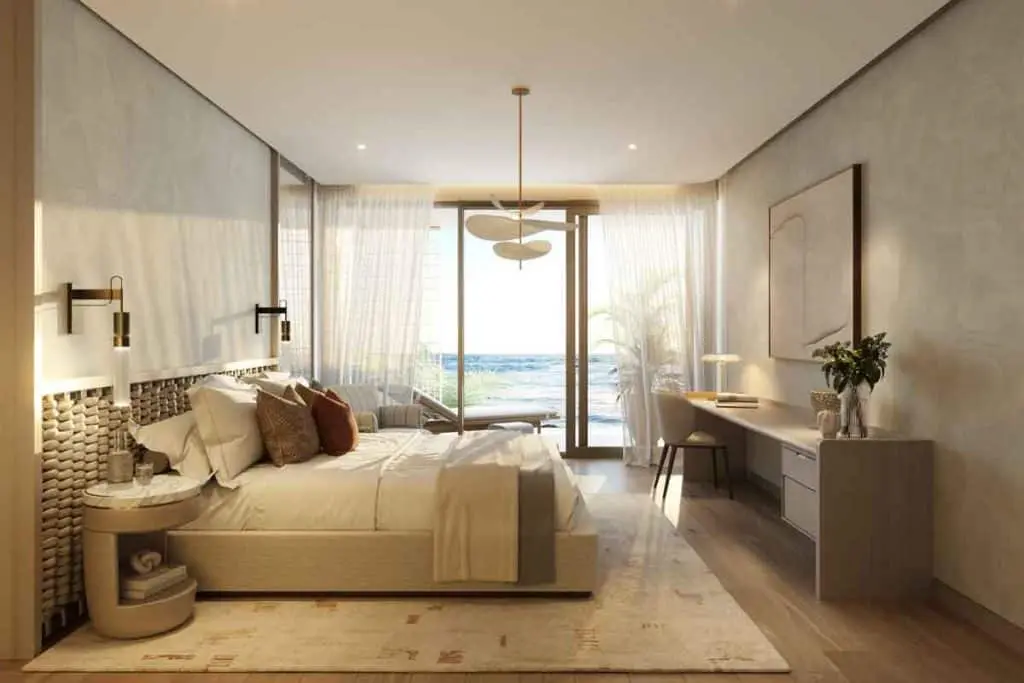 Japanese minimalist living room interior at Nobu Residences on Saadiyat Island, Abu Dhabi, featuring natural wood and floor-to-ceiling windows.