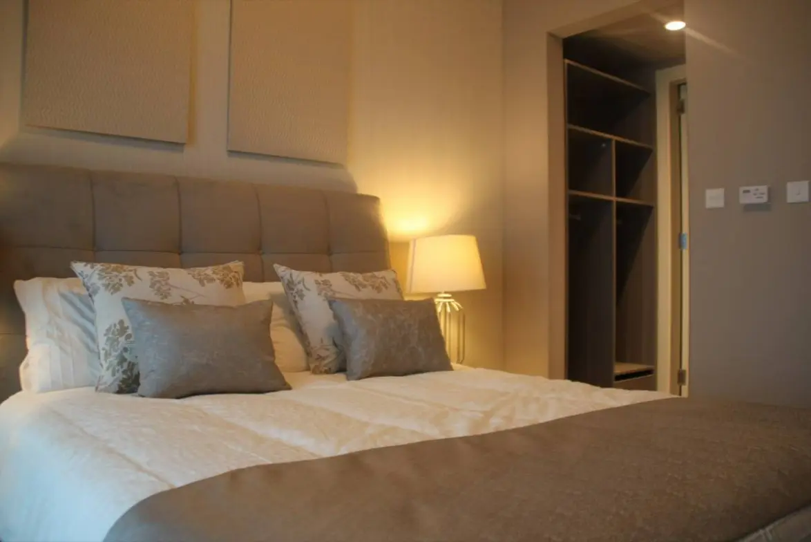 Leonardo Residences modern bedroom in Masdar City Abu Dhabi with premium fixtures and elegant interior finishes.jpg