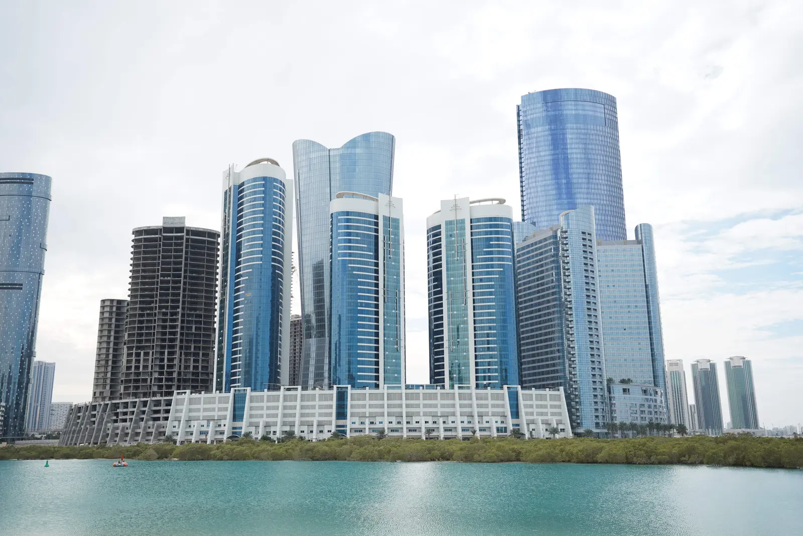 Sigma Tower Al Reem Island Abu Dhabi main entrance exterior view highlighting modern residential tower architecture and landscaping